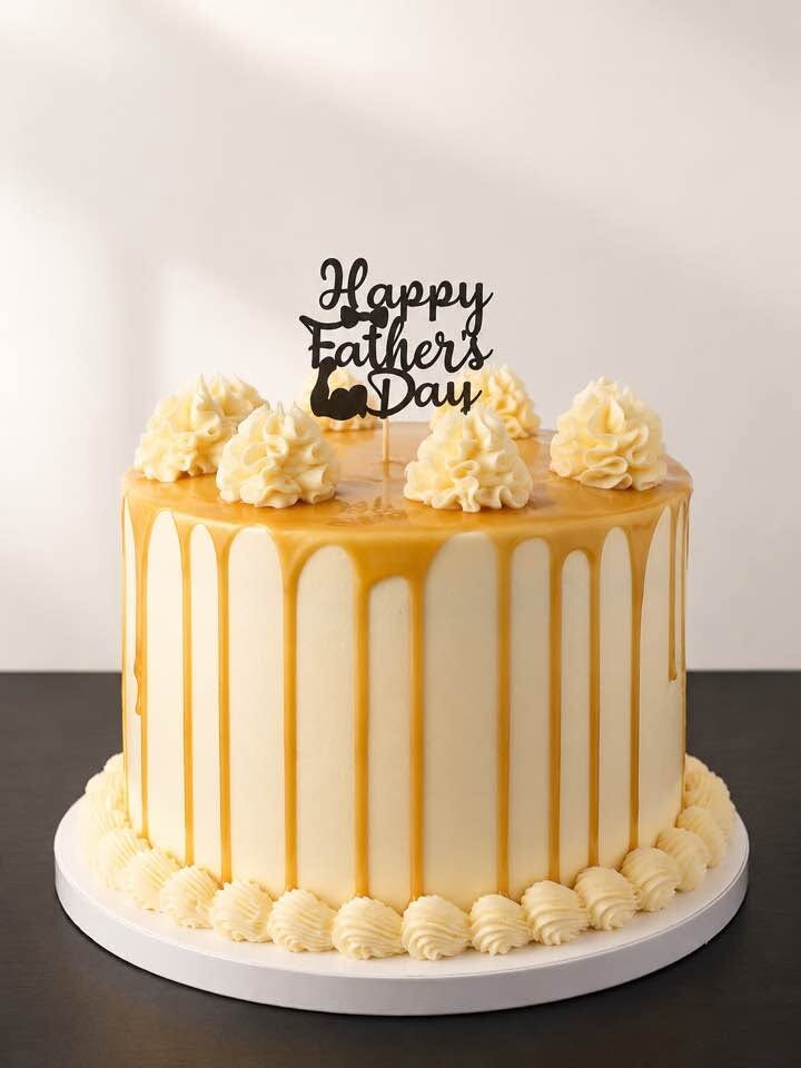 White celebration cake with gold drip